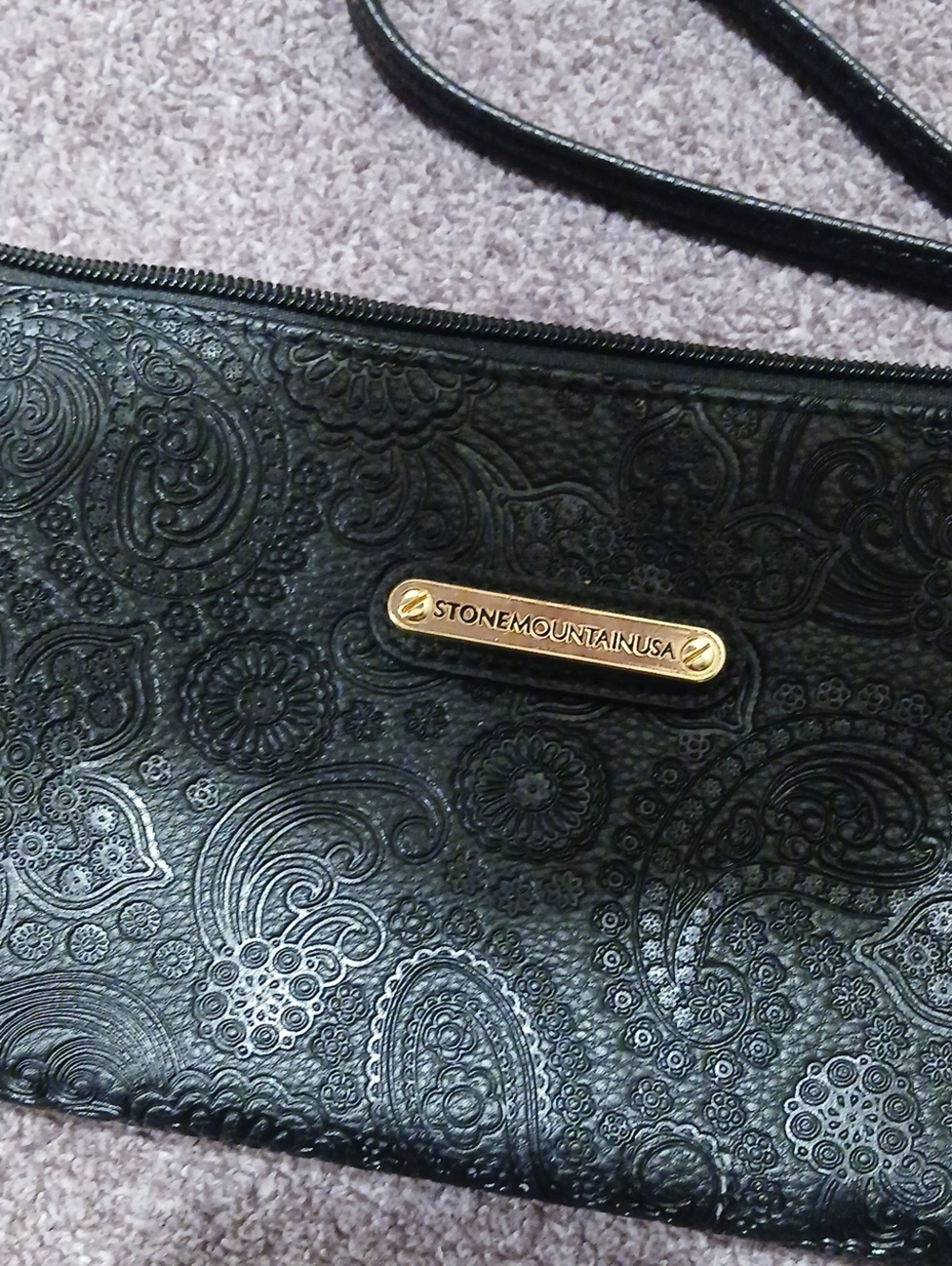 Stone Mountain Black Embossed Wrist Bag